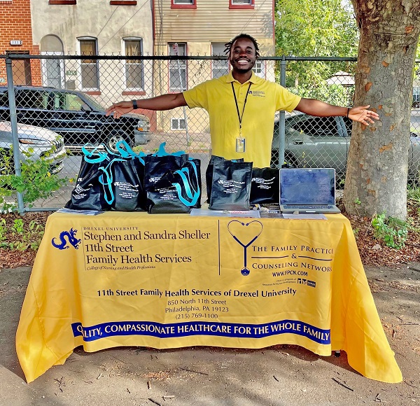 Meleki Wamulume, fitness coordinator at Stephen and Sandra Sheller 11th Street Family Health Services of Drexel University representing the Center at a recent health fair.
